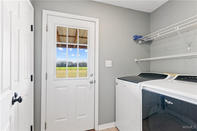 clothes washing area with laundry area and separate washer and dryer