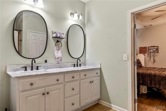 4458 19th St, Northport, AL 35476 - bathroom featuring ensuite bathroom, double vanity, and baseboards