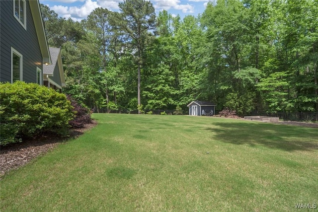 view of yard with a shed and an outbuilding