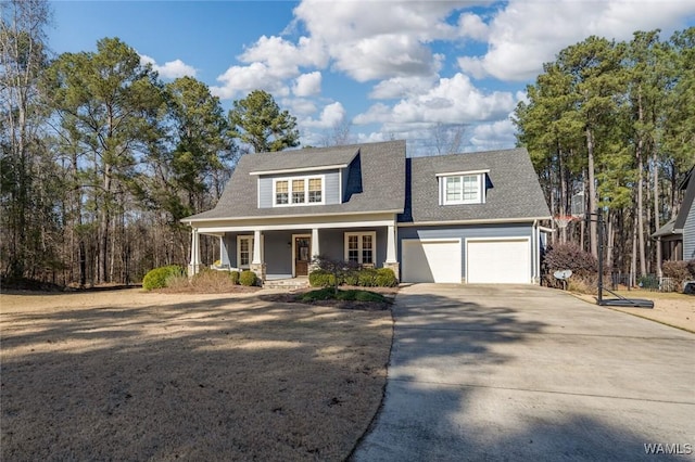 view of front of home featuring covered porch and a garage