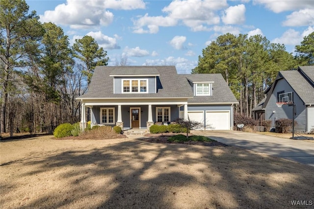 view of front of home with a porch and a garage