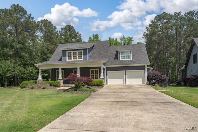 view of front facade with roof with shingles, an attached garage, a front yard, covered porch, and driveway