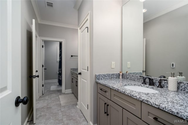 bathroom with vanity and crown molding