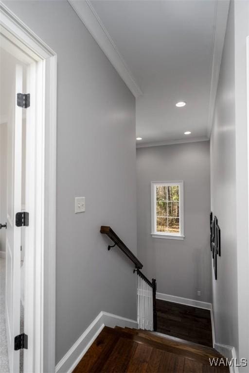 staircase featuring crown molding