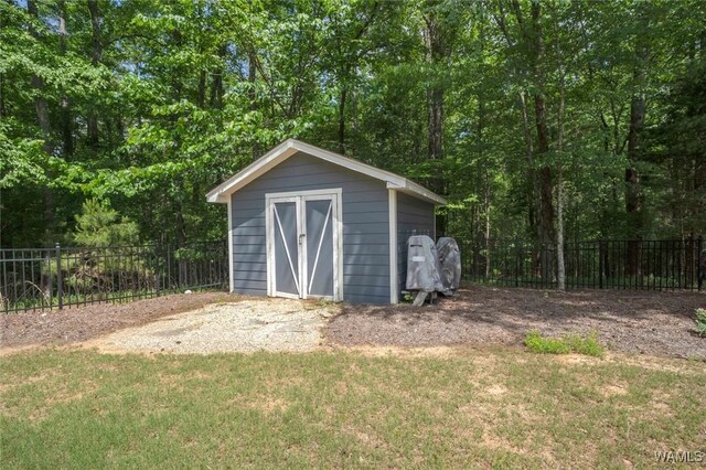 view of shed with fence