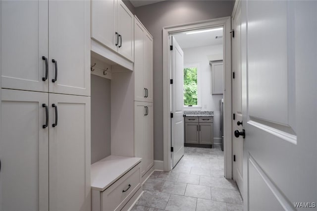 mudroom with light tile patterned floors
