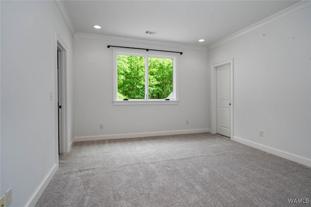 unfurnished room featuring carpet flooring, baseboards, and ornamental molding