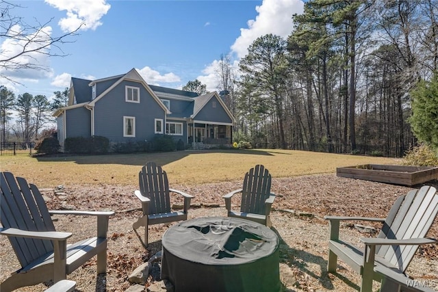 view of yard with a fire pit