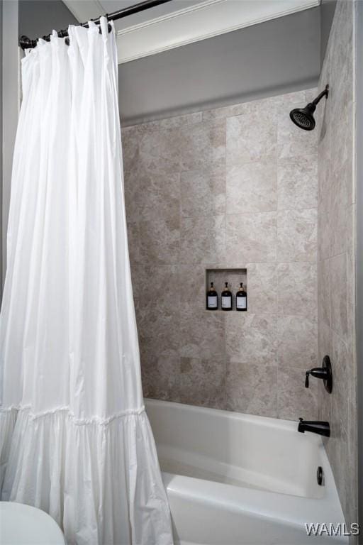 bathroom with shower / bath combination with curtain