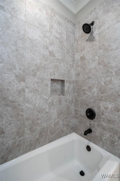 bathroom with crown molding and shower / bathtub combination