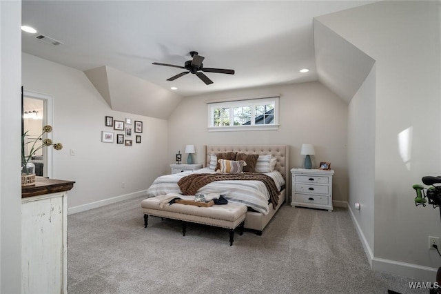 carpeted bedroom with ceiling fan and lofted ceiling