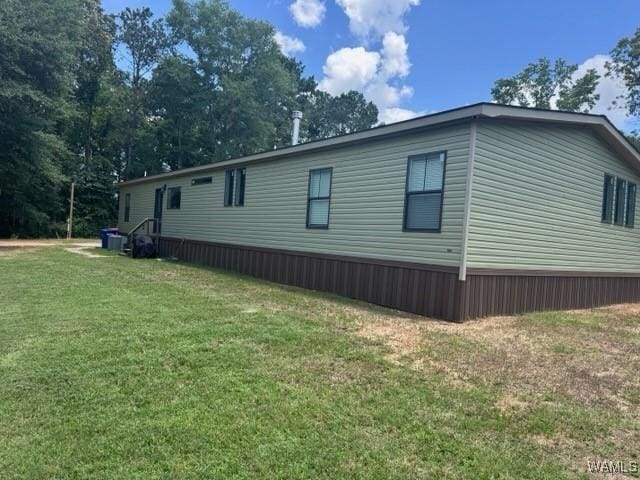 930 Pine Tree Rd, Centreville, AL 35042 - view of side of home with a yard