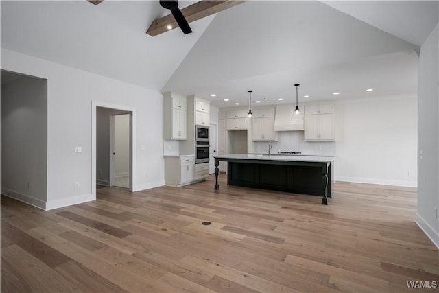 13947 Glenview Dr, Northport, AL 35475 - kitchen featuring stainless steel appliances, baseboards, light wood-style floors, ceiling fan, and white cabinets