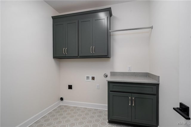 13947 Glenview Dr, Northport, AL 35475 - laundry room with washer hookup, baseboards, cabinet space, electric dryer hookup, and hookup for a gas dryer