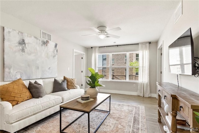 680 6th Ave NE Unit 3310, Tuscaloosa, AL 35404 - living area featuring wood finished floors, ceiling fan, and baseboards