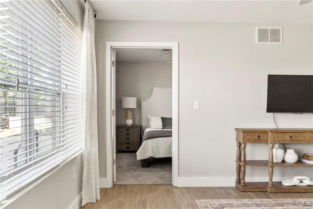 680 6th Ave NE Unit 3310, Tuscaloosa, AL 35404 - bedroom featuring baseboards and light wood-style flooring