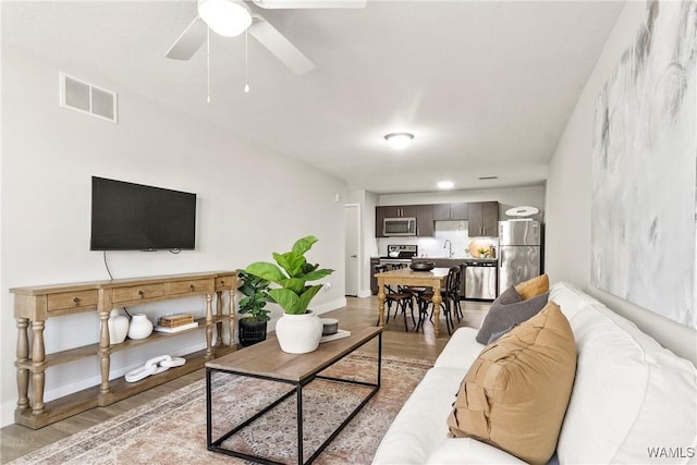 680 6th Ave NE Unit 3310, Tuscaloosa, AL 35404 - living room featuring light wood-style floors and ceiling fan