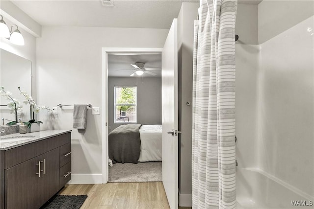 680 6th Ave NE Unit 3310, Tuscaloosa, AL 35404 - bathroom featuring vanity, wood finished floors, baseboards, ensuite bathroom, and ceiling fan