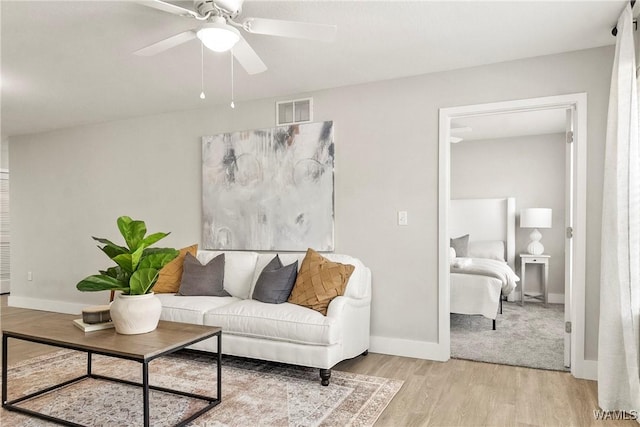 680 6th Ave NE Unit 3310, Tuscaloosa, AL 35404 - living room featuring light wood-style floors, a ceiling fan, and baseboards