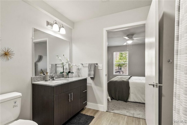 680 6th Ave NE Unit 3310, Tuscaloosa, AL 35404 - ensuite bathroom with vanity, wood finished floors, toilet, ceiling fan, and baseboards