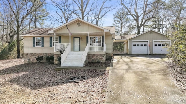 view of front of house featuring a porch and a garage