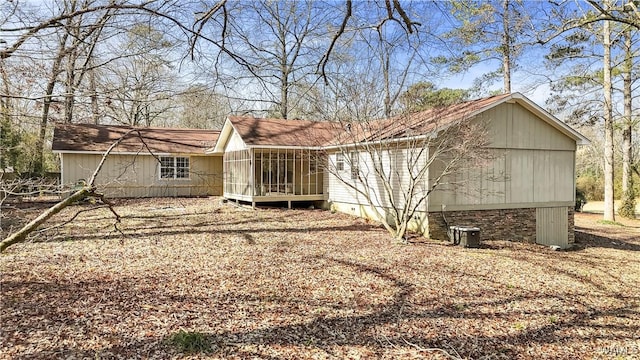 back of house featuring a sunroom