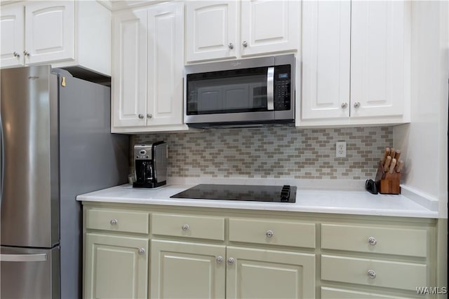 4032 Carousel Cir, Tuscaloosa, AL 35406 - kitchen with appliances with stainless steel finishes, backsplash, and light countertops