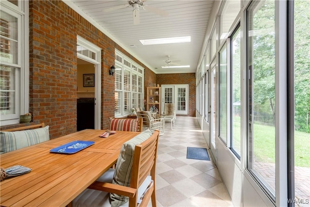 4032 Carousel Cir, Tuscaloosa, AL 35406 - sunroom / solarium with ceiling fan, tile patterned floors, and brick wall