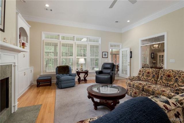 4032 Carousel Cir, Tuscaloosa, AL 35406 - living area with a fireplace, light wood-style flooring, ornamental molding, a ceiling fan, and recessed lighting