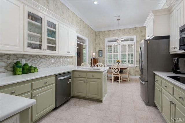 4032 Carousel Cir, Tuscaloosa, AL 35406 - kitchen featuring appliances with stainless steel finishes, green cabinets, light countertops, a chandelier, and wallpapered walls
