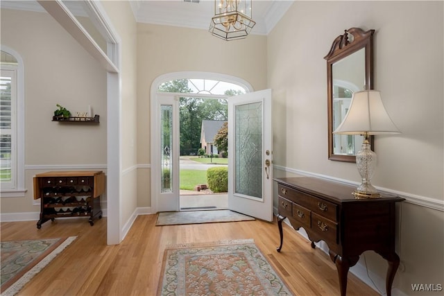 4032 Carousel Cir, Tuscaloosa, AL 35406 - foyer with wood finished floors, a chandelier, and crown molding