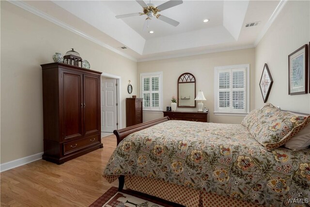 4032 Carousel Cir, Tuscaloosa, AL 35406 - bedroom featuring light wood-style flooring, multiple windows, a raised ceiling, ornamental molding, and recessed lighting