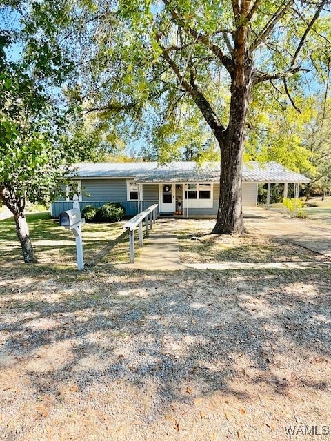 ranch-style home with a carport