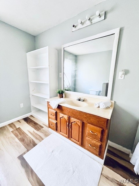 bathroom featuring hardwood / wood-style floors and vanity