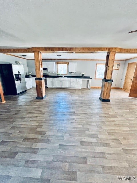 unfurnished living room featuring light hardwood / wood-style flooring