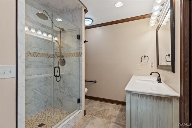 bathroom featuring vanity, crown molding, a shower with shower door, and toilet