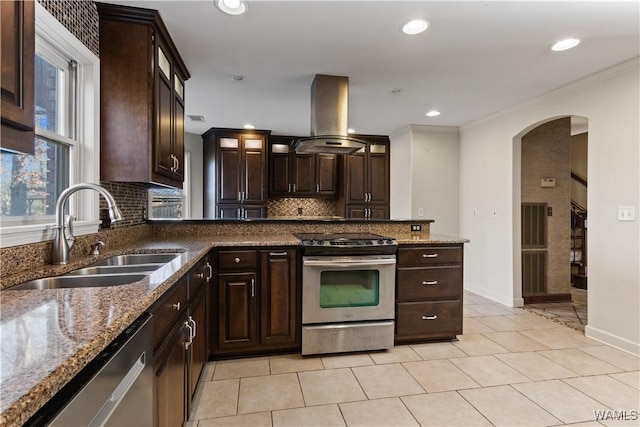 kitchen with island exhaust hood, stainless steel appliances, sink, and dark brown cabinets