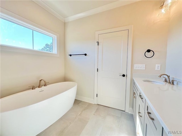 bathroom featuring vanity, a bathtub, tile patterned floors, and ornamental molding