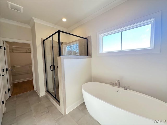 bathroom with tile patterned flooring, plus walk in shower, and ornamental molding