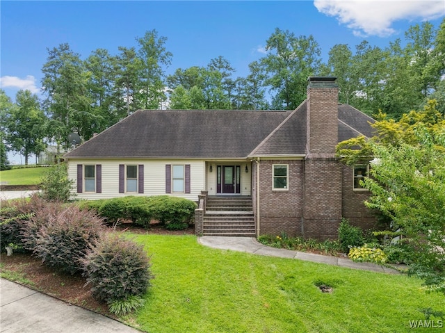 4184 Graves Gap Rd, Hayden, AL 35079 - view of front facade featuring a front lawn, a chimney, brick siding, and a shingled roof