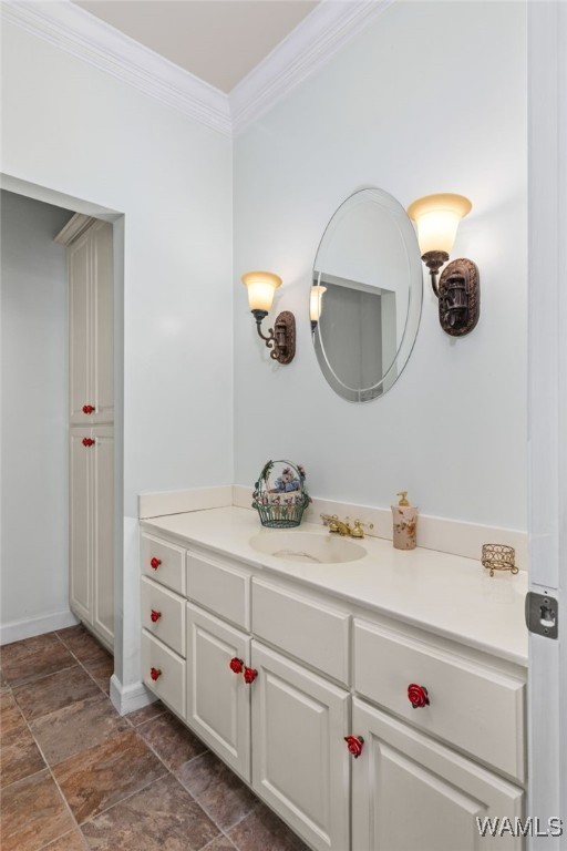 4184 Graves Gap Rd, Hayden, AL 35079 - bathroom with ornamental molding, vanity, and stone finish floors