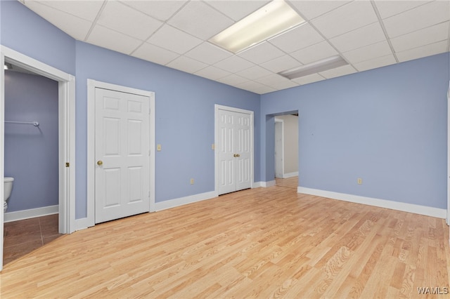 4184 Graves Gap Rd, Hayden, AL 35079 - empty room with a drop ceiling and wood finished floors