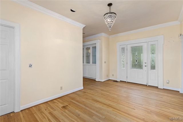 4184 Graves Gap Rd, Hayden, AL 35079 - entrance foyer with a chandelier, ornamental molding, and light wood-type flooring