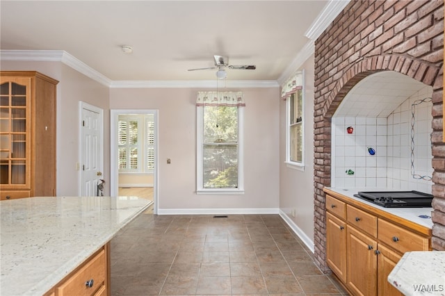 4184 Graves Gap Rd, Hayden, AL 35079 - kitchen featuring a ceiling fan, black electric stovetop, ornamental molding, light stone countertops, and brown cabinets