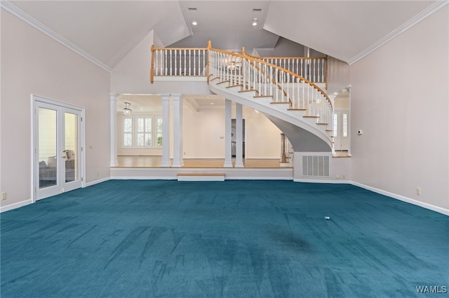 4184 Graves Gap Rd, Hayden, AL 35079 - unfurnished living room with high vaulted ceiling, carpet flooring, stairway, crown molding, and french doors