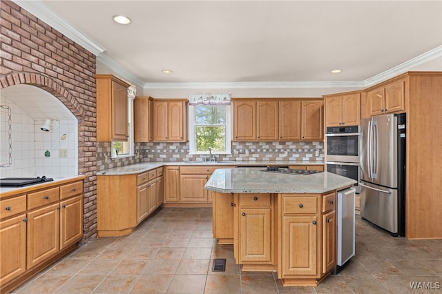 4184 Graves Gap Rd, Hayden, AL 35079 - kitchen with stainless steel appliances, ornamental molding, a center island, decorative backsplash, and recessed lighting