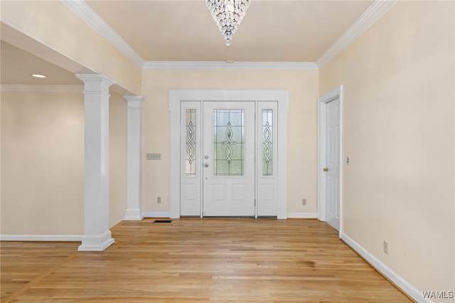 4184 Graves Gap Rd, Hayden, AL 35079 - foyer entrance with light wood finished floors, crown molding, and a chandelier