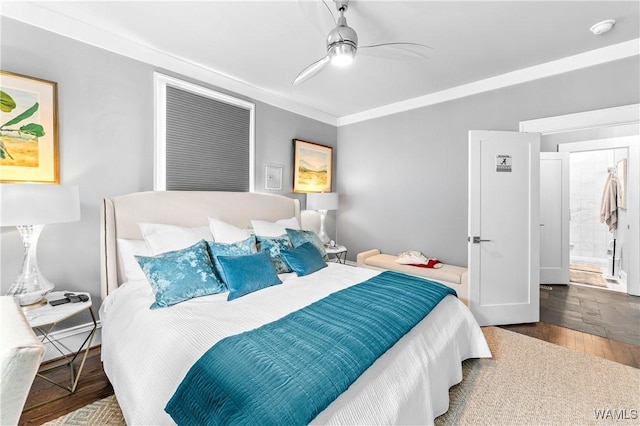 bedroom featuring ceiling fan, ornamental molding, and wood finished floors