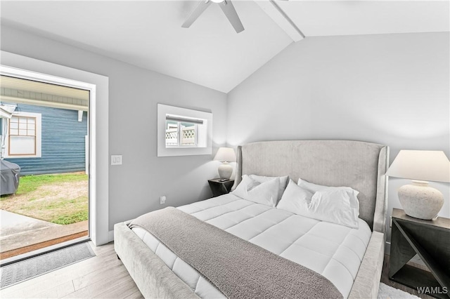 bedroom featuring light wood-style floors, ceiling fan, and vaulted ceiling