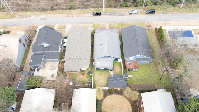 birds eye view of property with a residential view